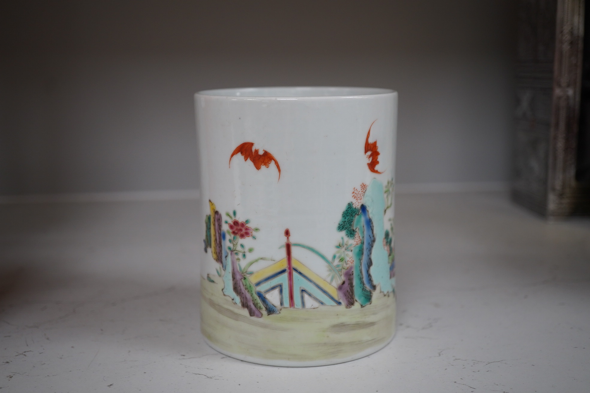 A Chinese famille rose figurative brush pot, 12cm high. Condition- good